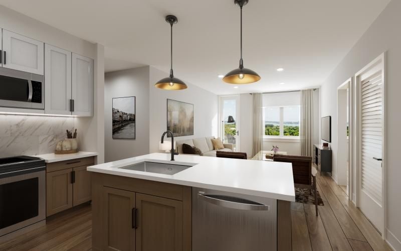 a kitchen with under cabinet lighting and island