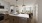 a kitchen with under cabinet lighting and island