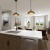 a kitchen with under cabinet lighting and island