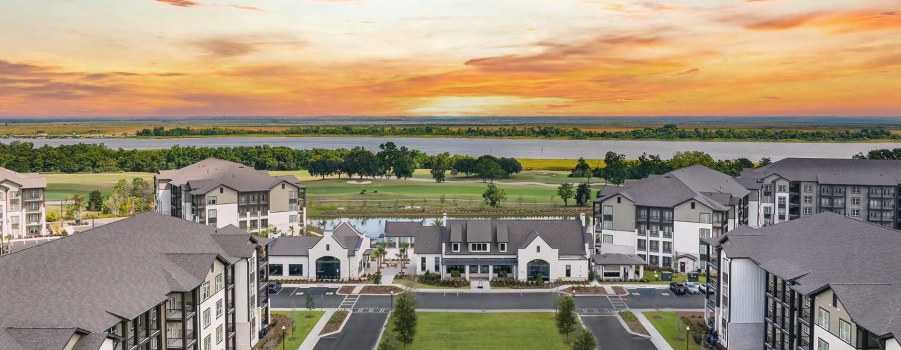 sun setting over buildings